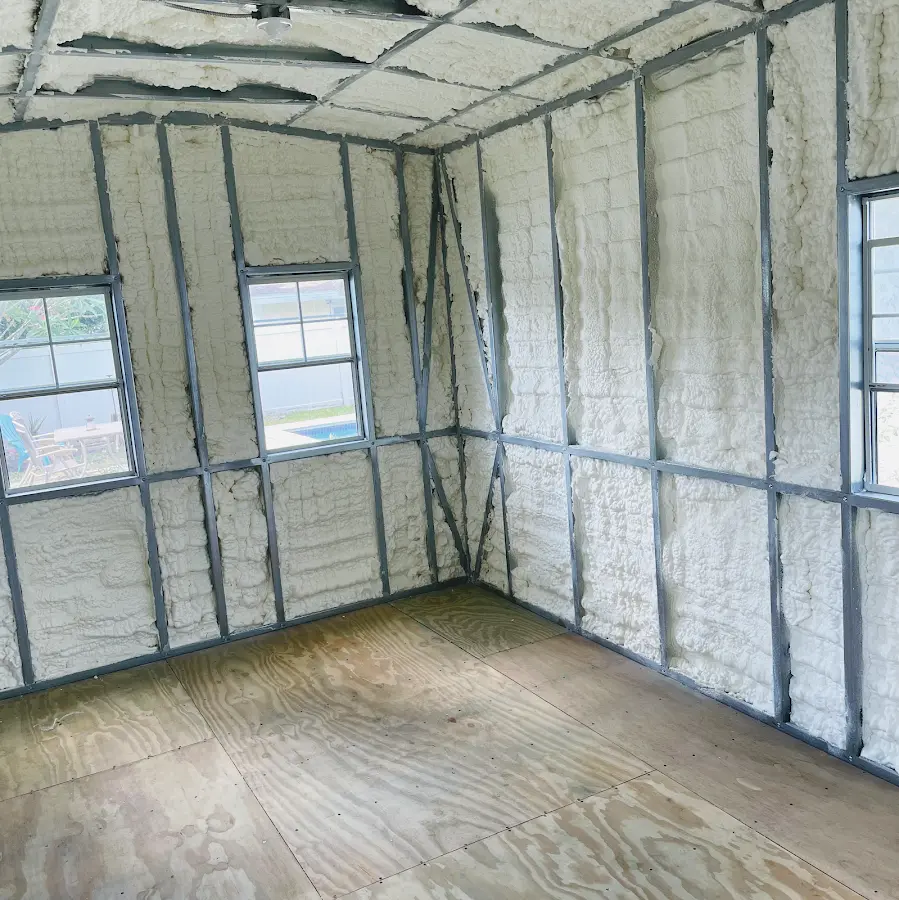 Closed-cell spray foam insulation applied to wall cavities in a residential project in Derby